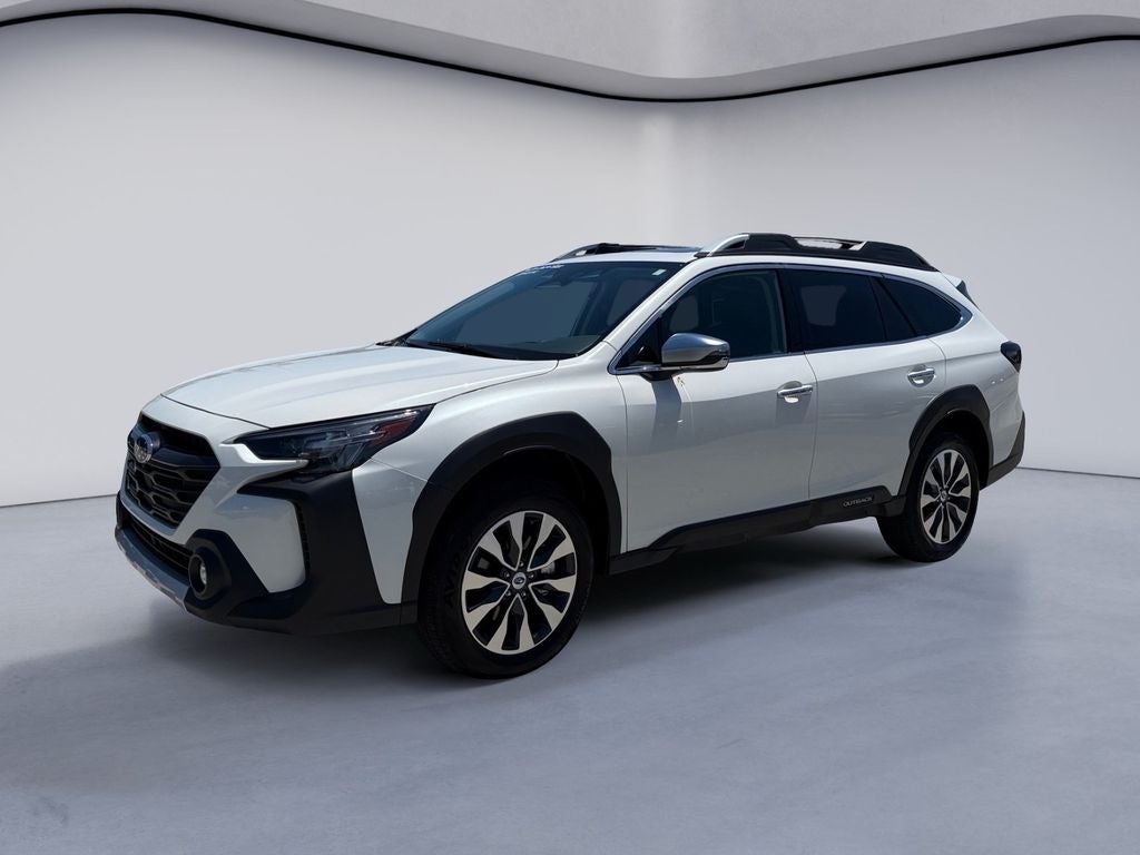 2024 Subaru Outback Touring in Crystal White Pearl — front three-quarter view
