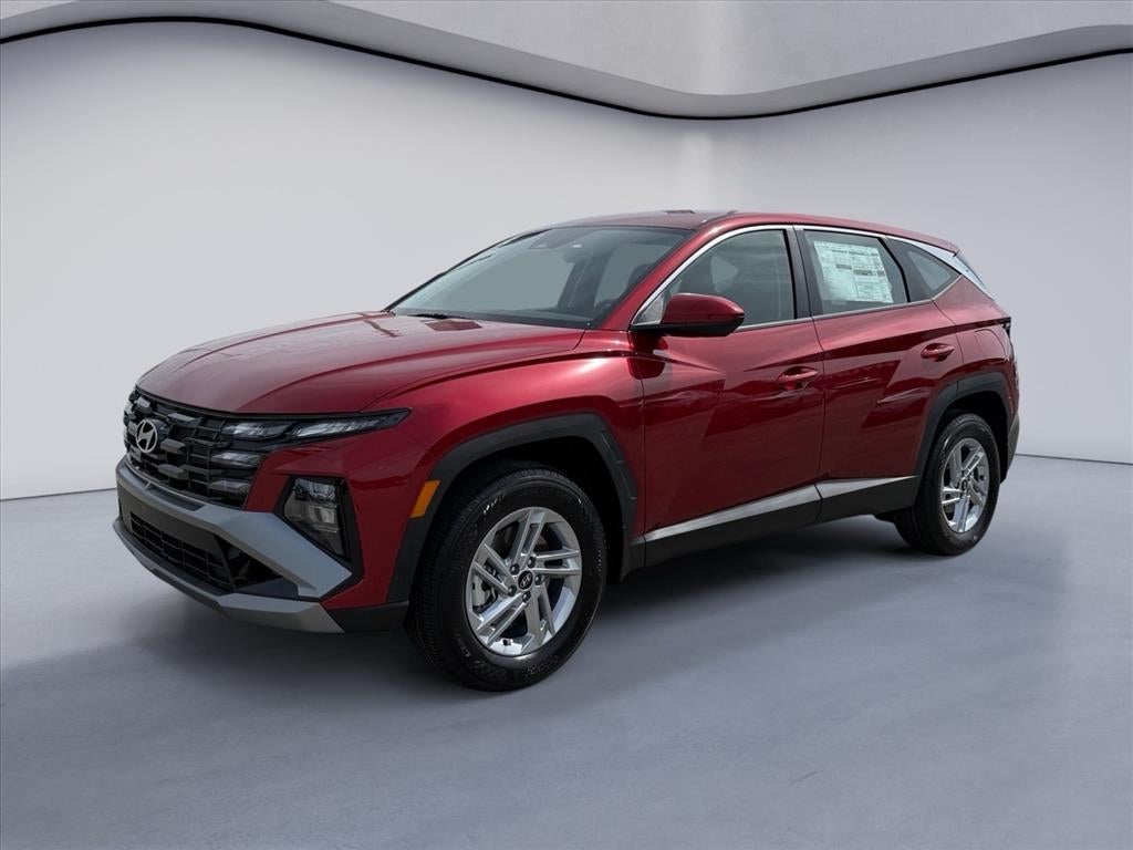 2026 Hyundai TUCSON SE in Ultimate Red — front three-quarter view