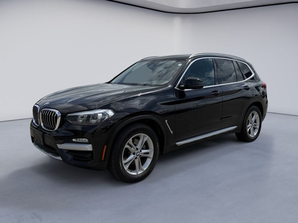 2019 BMW X3 sDrive30i in Jet Black — front three-quarter view
